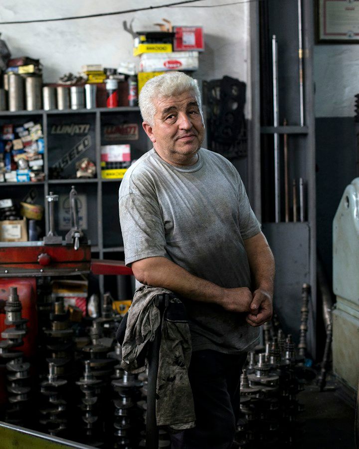 Machinist standing in a parts workshop